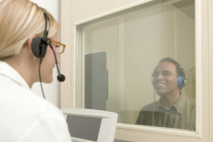 Audiologist conducting a hearing test