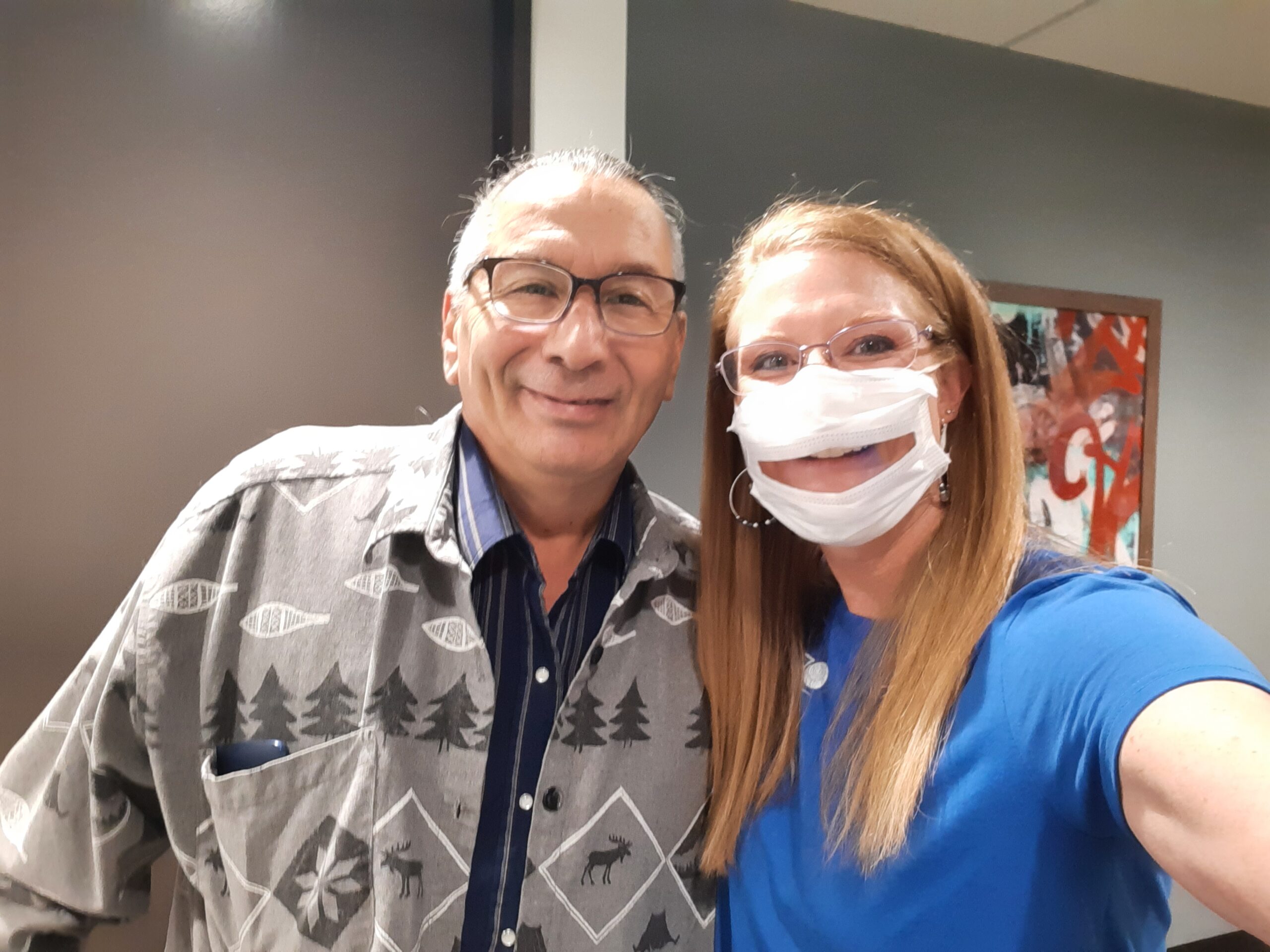 Dr. Dusty Jessen with one of Columbine Hearing Care's happy patients