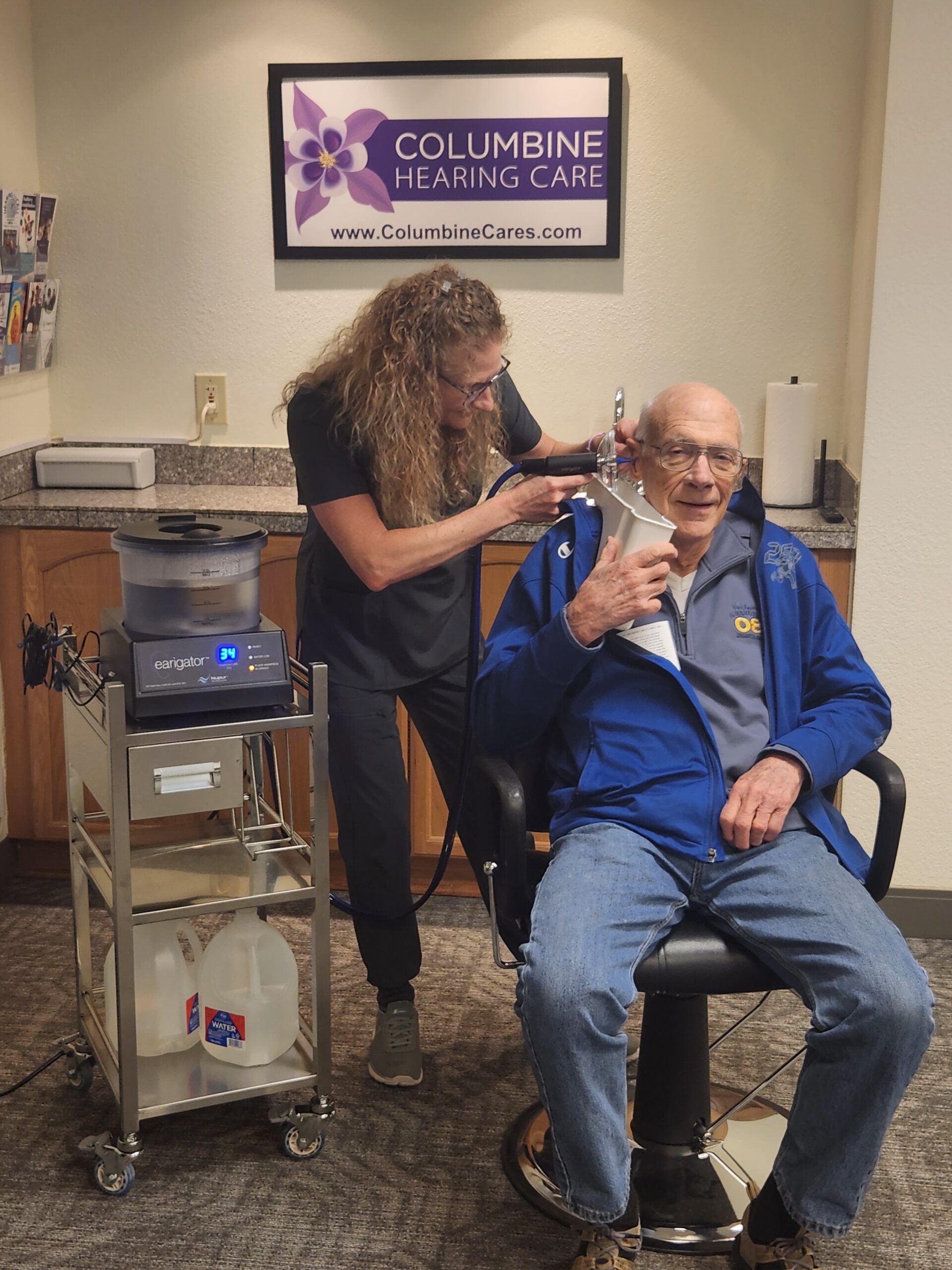 Dr. Dusty performing cerumen removal.