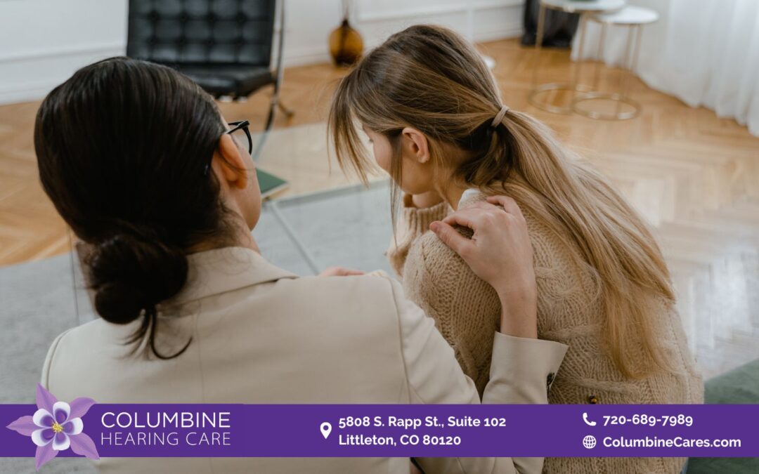 Two women with their backs turned to the camera, facing away from the viewer.